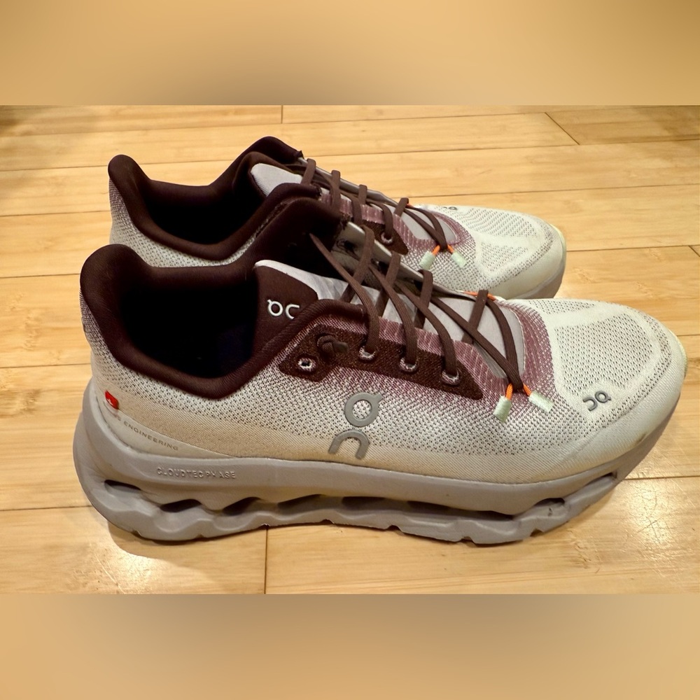 On Running Cream and Brown Athletic Shoes